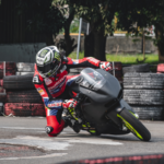 Man on motorcycle at an event